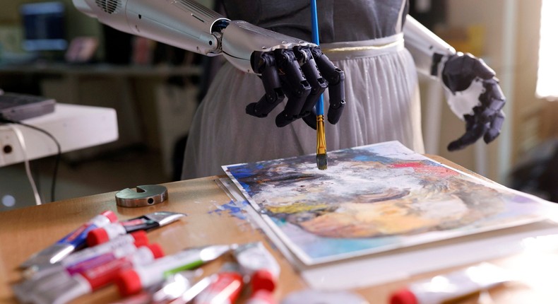 Sophia the robot working on a painting.
