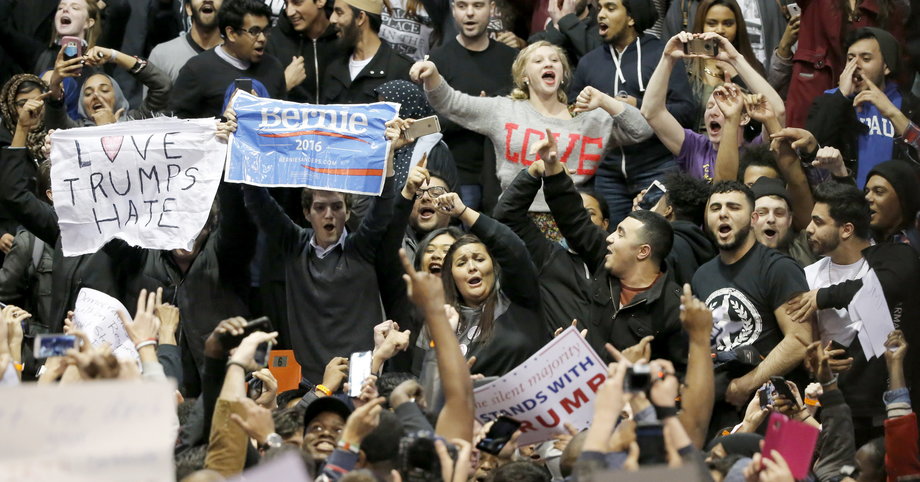 Protesters against Republican presidential candidate Donald Trump chant 'Bernie, Bernie, and We Stopped Trump,' after a rally on the campus of the University of Illinois-Chicago, was canceled Friday, March 11, 2016, in Chicago.