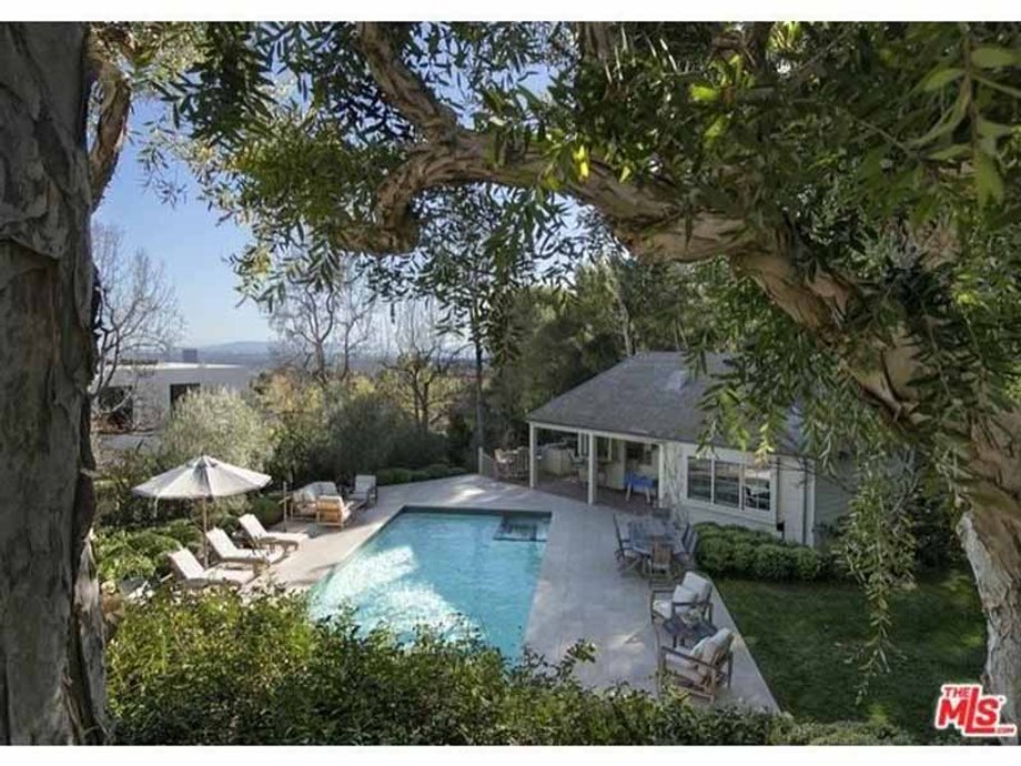 Out back, the pool and pool house overlook the city.