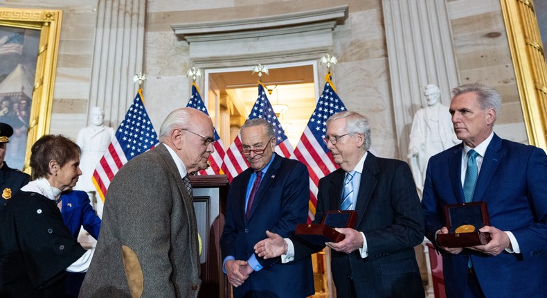 Gladys and Kenneth Sicknick, the family members of fallen Capitol police officer Brian Sicknick, walked past Senate Minority Leader Mitch McConnell and House Minority Leader Kevin McCarthy during a ceremony on Tuesday.Bill Clark/CQ-Roll Call, Inc via Getty Images