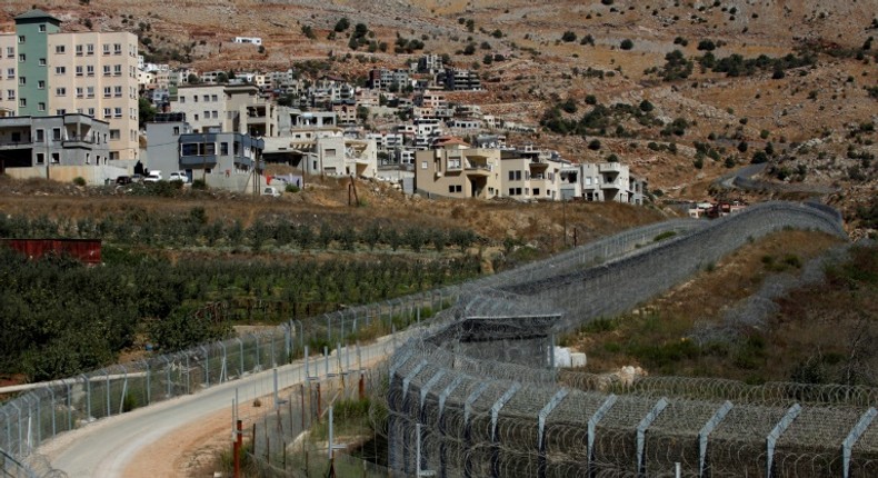 The village of Majdal Shams (L)in the Golan Heights, an area that US refers to as Israeli-controlled rather than Israeli-occupied in its latest annual human rights report