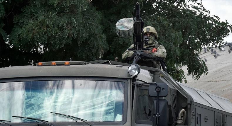 A Russian serviceman on a vehicle with the Z symbol in Melitopol, Ukraine.