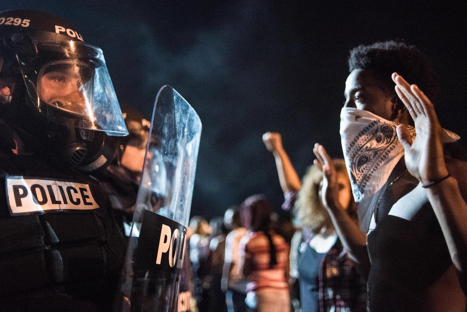 Police officers facing off with protesters on Interstate 85 during protests in the early hours of September 21 in Charlotte, North Carolina.