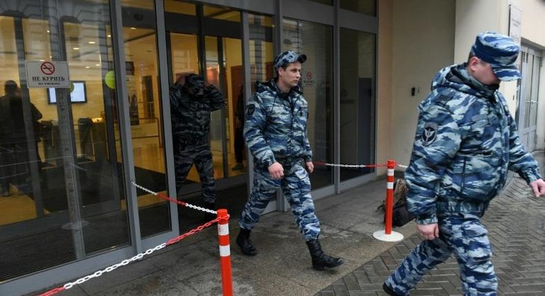 Police officers walk out of an office building, which houses the premises of Kremlin critic Mikhail Khodorkovsky's Open Russia movement, during a police raid, Moscow, April 27, 2017