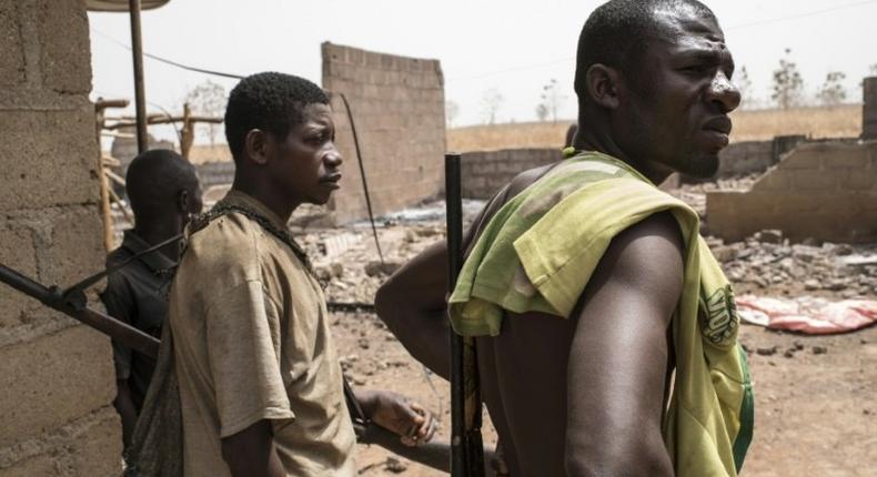 Vigilantes in Kaduna stand guard after an attack by Fulani herdsmen (Dailypost)