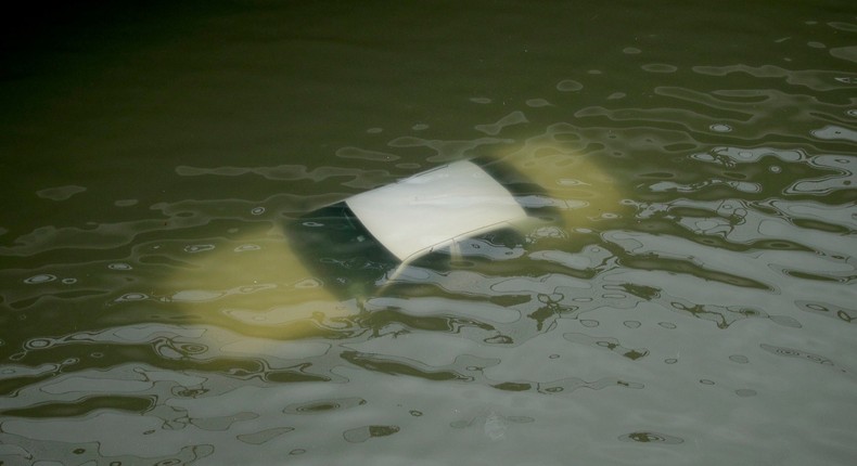 A car submerged on a freeway flooded by Harvey on Sunday near downtown Houston.