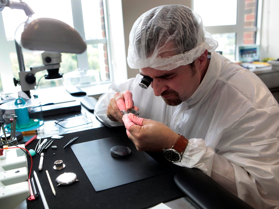 A watchmaker assembling a watch in Shinola's Detroit factory.