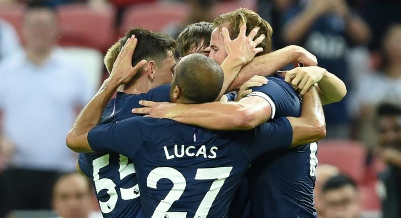 Tottenham's Harry Kane (R) is congratulated by teammates after scoring the decider in their pre-season friendly against Juventus