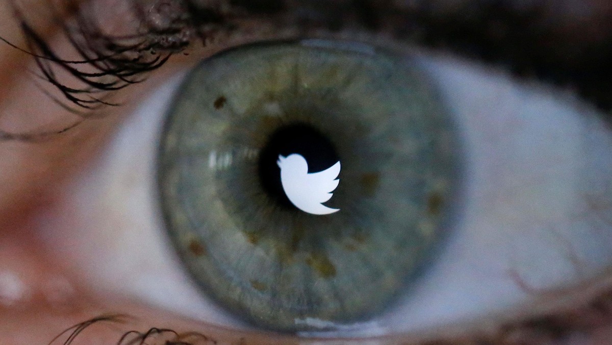 An illustration picture shows the Twitter logo reflected in the eye of a woman in Berlin