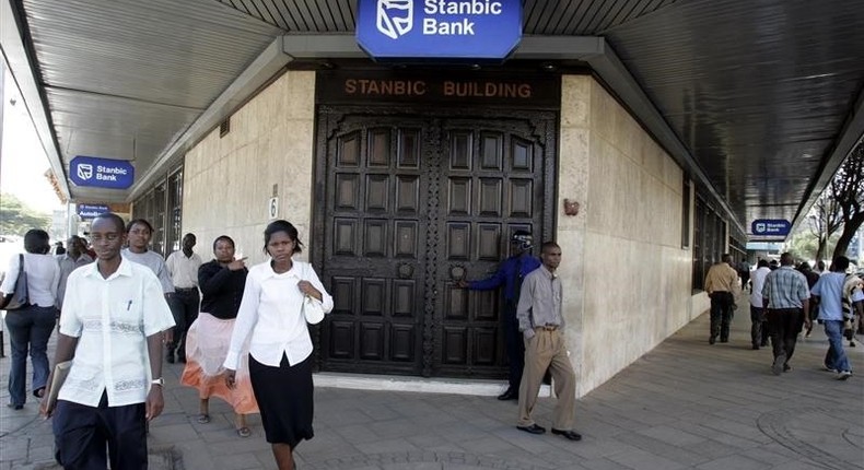 Kenyan city residents walk past Stanbic Bank in the capital Nairobi  in a file photo.  REUTERS/Antony Njuguna