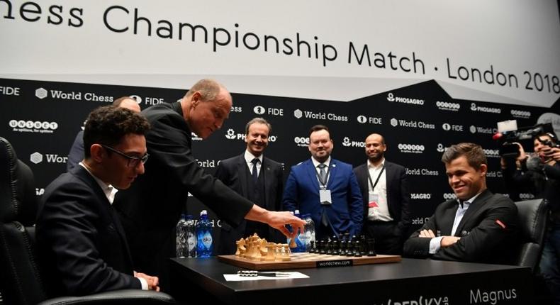 The 2018 World Chess Championship match got off to a comical start when Hollywood star Woody Harrelson misheard Fabiano Caruana's opening move against defending world champion Magnus Carlsen