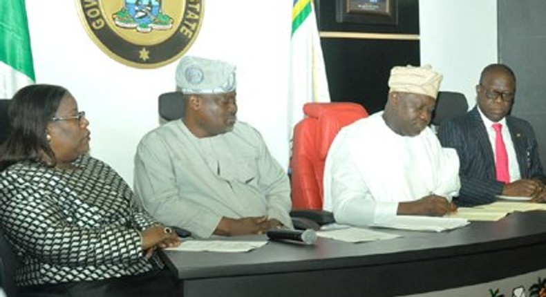 Lagos State Governor, Mr. Akinwunmi Ambode (2nd right), signing the Property Protection and Neighbourhood Safety Agency Laws.