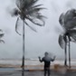 A man reacts in the winds and rain in Luquillo as Hurricane Irma slammed across islands in the northern Caribbean