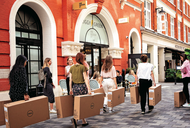 Company employees struggle to carry heavy boxes that contain Dell computing items through West End Streets, on 23rd August 2022, in London, England