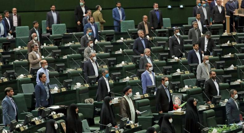 For the opening session of Iran's new parliament, a seat was left vacant between each lawmaker in accordance with social distancing guidelines although few wore masks against the coronavirus