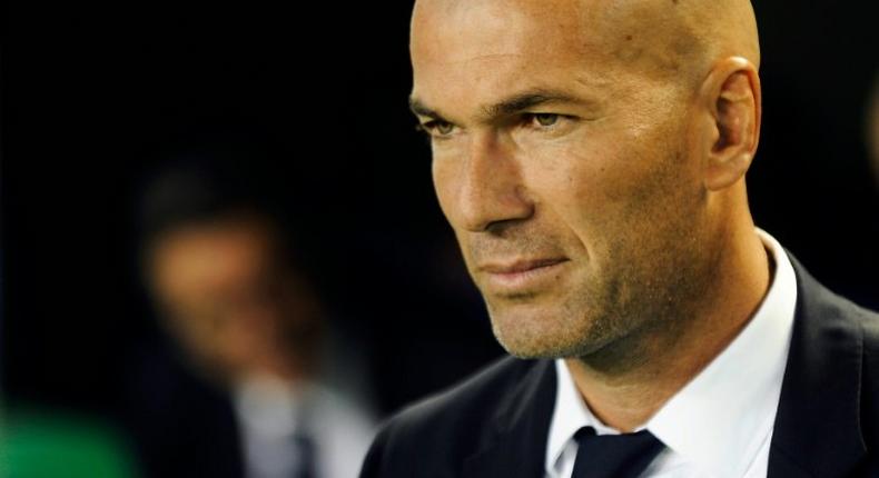 Real Madrid's French coach Zinedine Zidane waits before the Spanish league football match Real Betis vs Real Madrid CF at the Benito Villamarin stadium in Sevilla on October 15, 2016