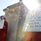 Protesters Houston and Martin hold signs against Georgia's anti-abortion heartbeat bill at Georgia State Capitol in Atlanta