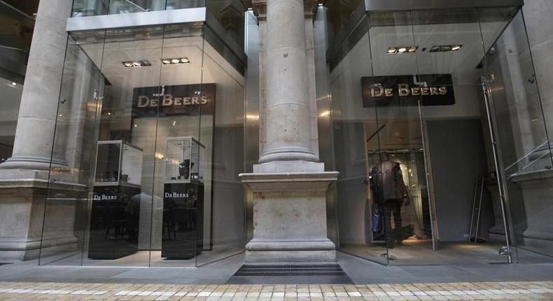 A man enters a branch of De Beers at the Royal Exchange shopping centre in the City of London August 16, 2010. REUTERS/Andrew Winning