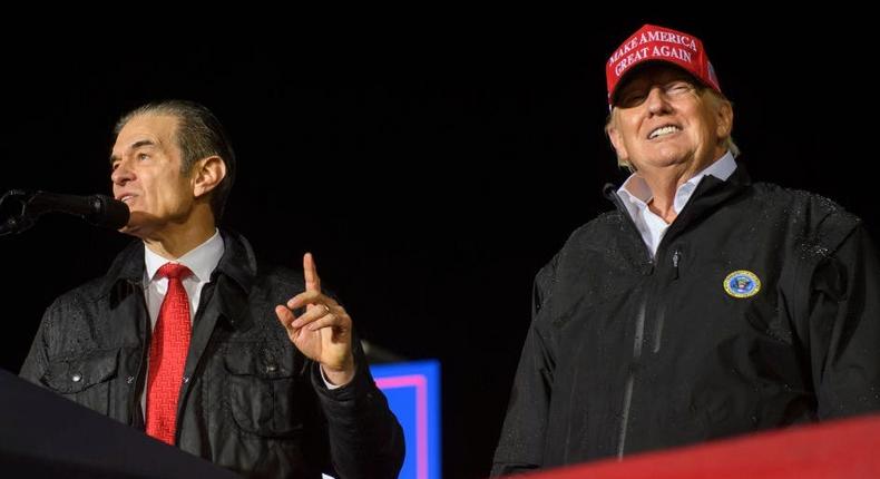 Pennsylvania Republican U.S. Senate candidate Dr. Mehmet Oz joins former President Donald Trump onstage during a rally in support of his campaign at the Westmoreland County Fairgrounds on May 6, 2022 in Greensburg, Pennsylvania.