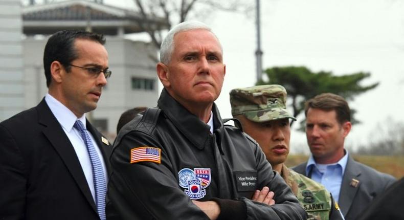 US Vice President Mike Pence (C) is expected to offer a renewed commitment to Japan's security amid a growing threat from a nuclear armed North Korea