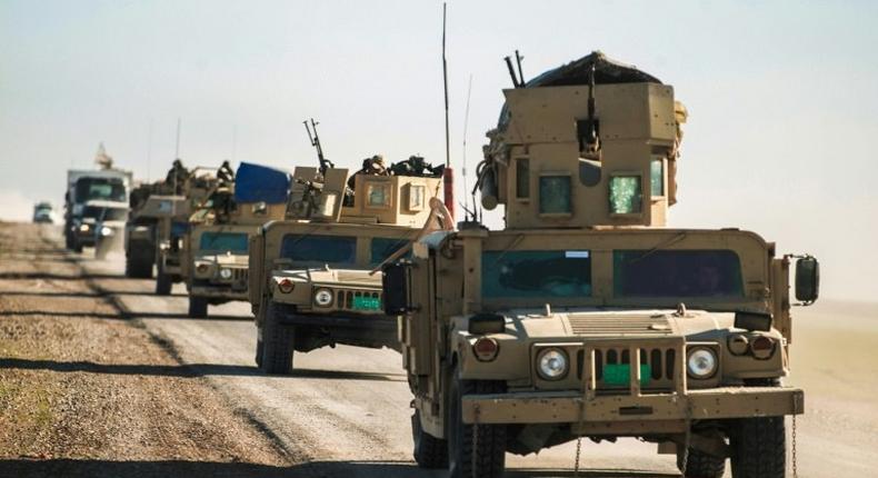 Iraqi tanks and armoured vehicles advance towards the village of Sheikh Younis, after the offensive to retake the western side of Mosul commenced on February 19, 2017