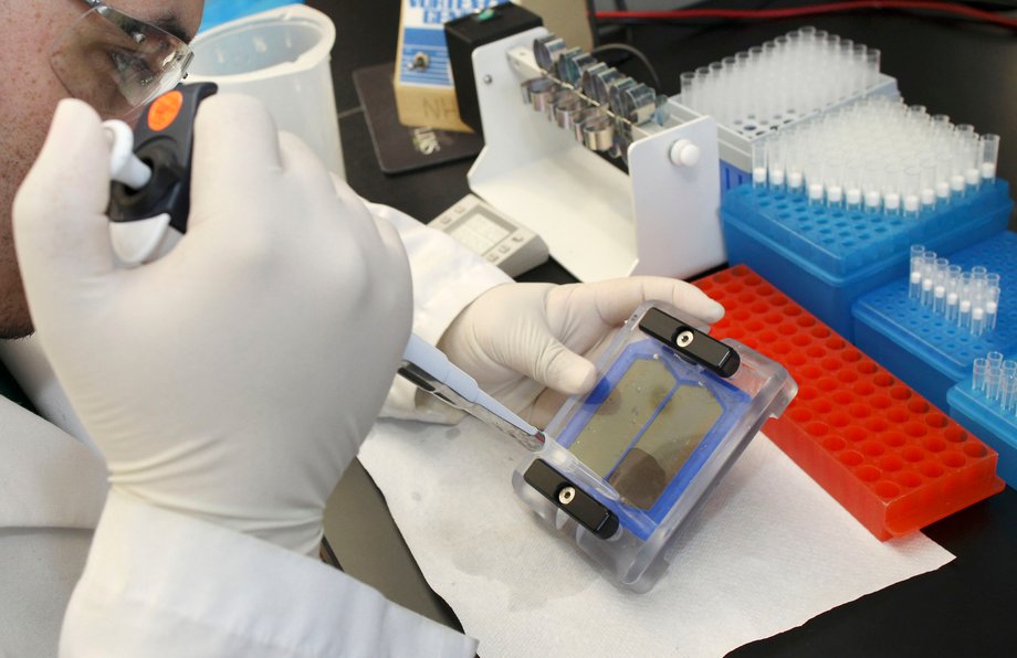 Bio Technician Javier Quinones demonstrates the beginning of the sequencing procedure in the sequencing laboratory at the J. Craig Venter Institute in Rockville, Maryland, March 29, 2010.