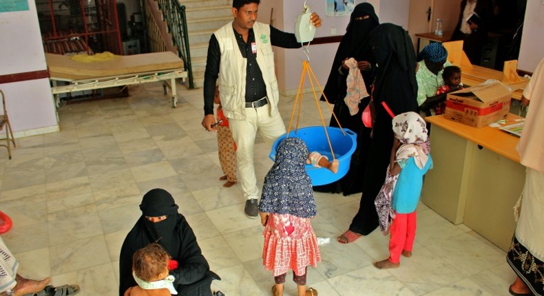 Children suffering from malnutrition receive treatment at a clinic in Yemen's northern Hajjah province