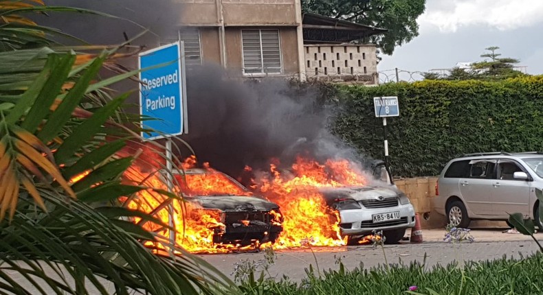 Vehicles burning at the Dusit complex