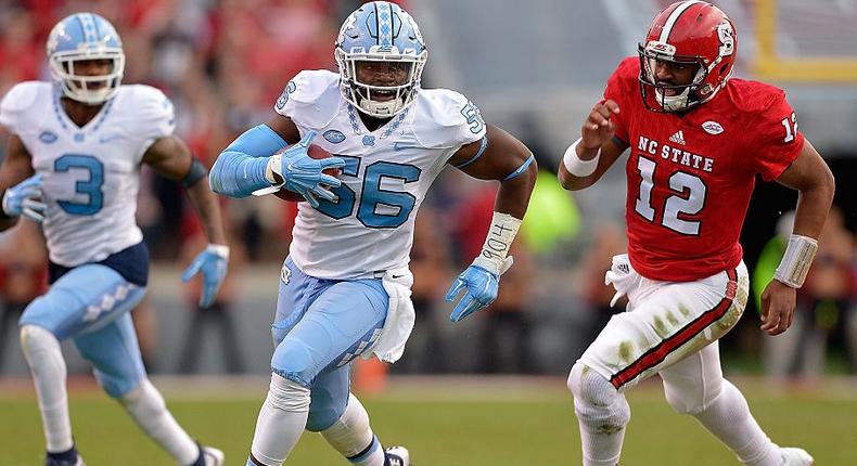 Andre Smith of the North Carolina Tar Heels intercepts a pass during a 2015 game against North Carolina State University.