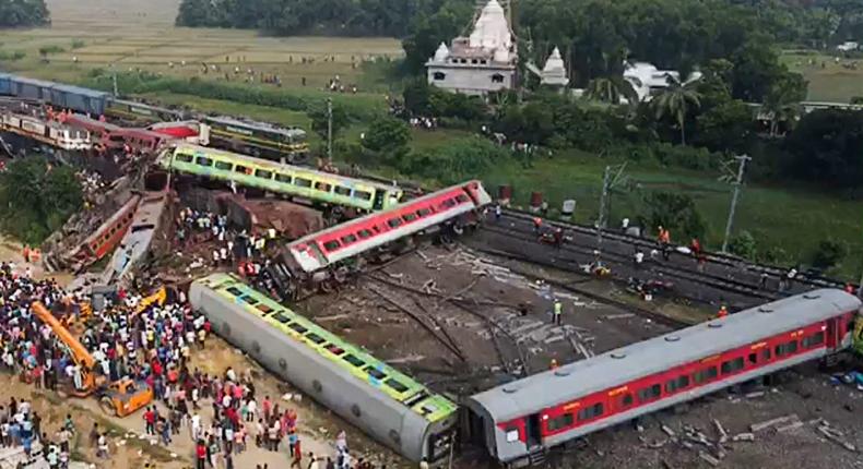 This screen grab made from AFPTV video footage taken on June 3, 2023 shows people gathering at the accident site of a three-train collision near Balasore, in the eastern state of Odisha.JAYANTA SHAW / Getty Images