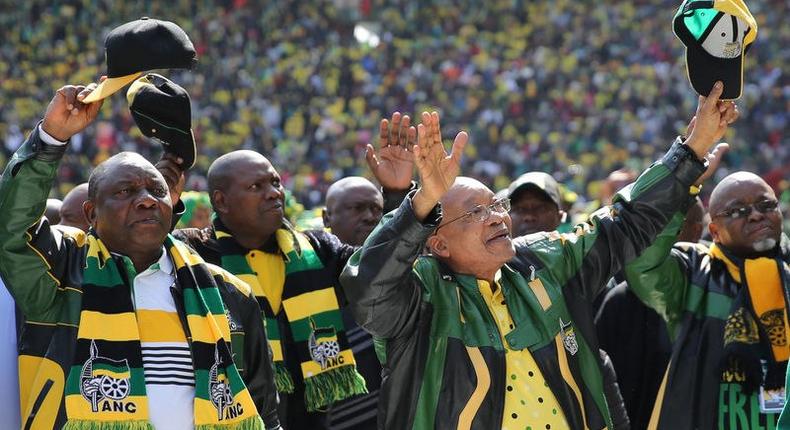 African National Congress (ANC) president,Jacob Zuma (2nd R) waves to his supporters as he arrives for the parties traditional Siyanqoba rally ahead of the August 3 local municipal elections in Johannesburg, South Africa July 31, 2016.