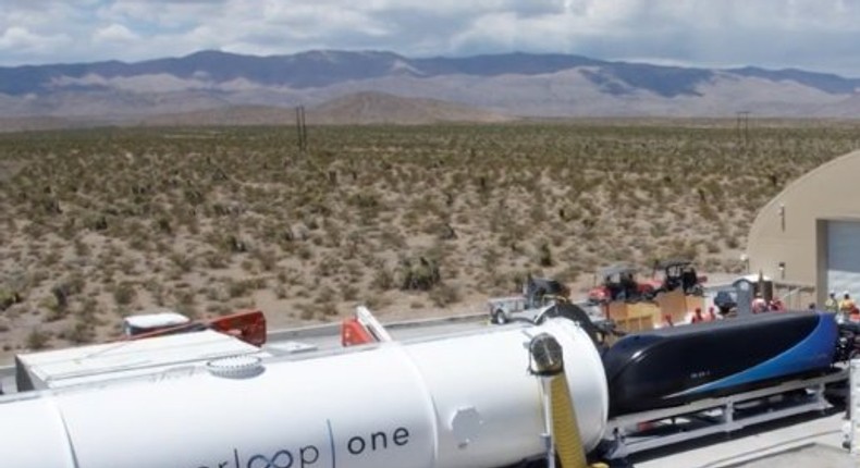 Hyperloop One loads its pod (right) into a vacuumed-sealed tube (left) for the test.