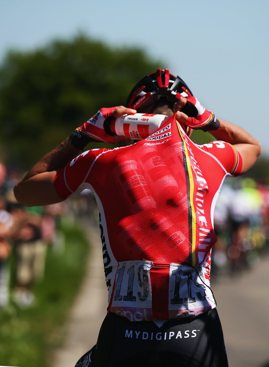 Jelle Vanendert has the glorious task of fetching water bottles for his teammates. Someone's gotta do it.