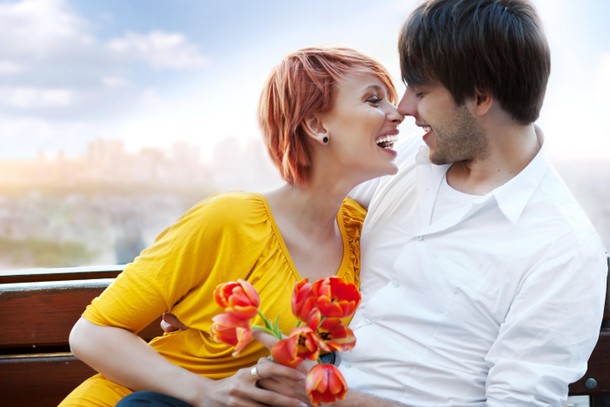 Young happy smiling attractive couple together outdoors