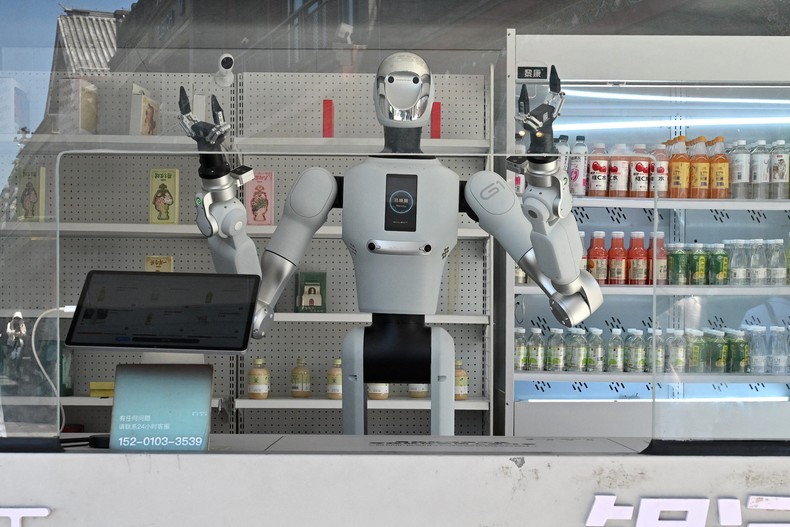 Two economists, Gerry Tsoukalas and Brett Falk, warn that companies could be self-destructing by replacing workers with AI and eroding consumer demand.ADEK BERRY / AFP via Getty Images