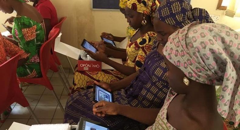 Chibok schoolgirls with Opon Imo tablets