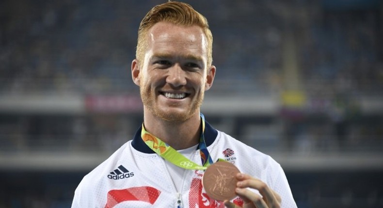 Britain's Greg Rutherford poses with his Olympic long jump bronze medal in Rio de Janeiro on August 14, 2016