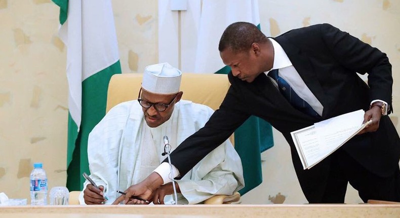 AGF Malami and President Buhari sign dotted lines (Presidency)