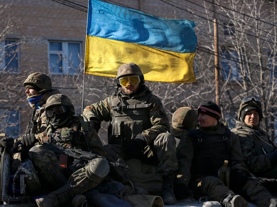 Members of the Ukrainian armed forces ride an armored personnel carrier in Artemivsk, eastern Ukraine, February 24, 2015.