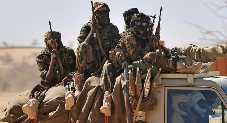 Soldiers of the Chadian army are driven in a pickup near Iriba, northern Chad on March 12, 2009