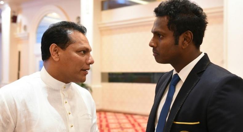 Sports Minister Dayasiri Jayasekera (L) has given his support for an investigation into the country's controversial 2011 World Cup loss against India