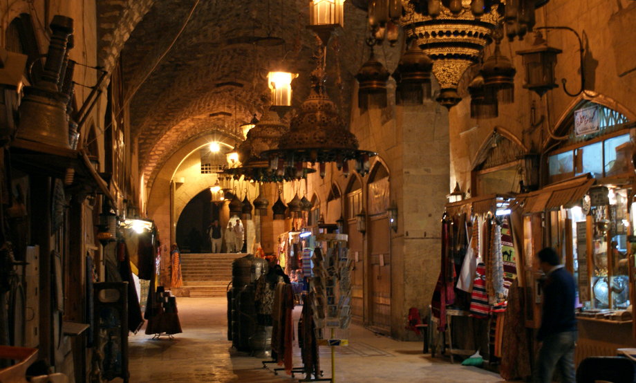 People walk inside the Khan al-Shounah market, in the Old City of Aleppo, in 2009.