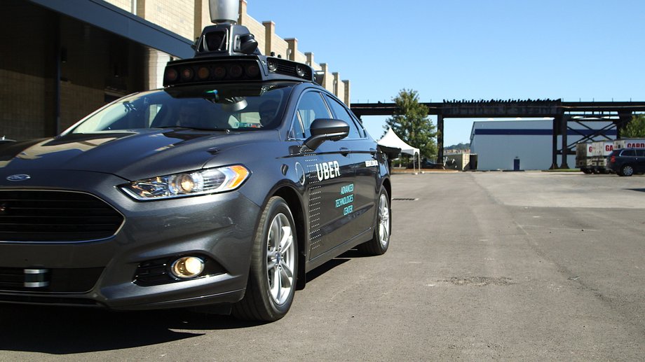 An Uber self-driving car with Lidar unit on the roof