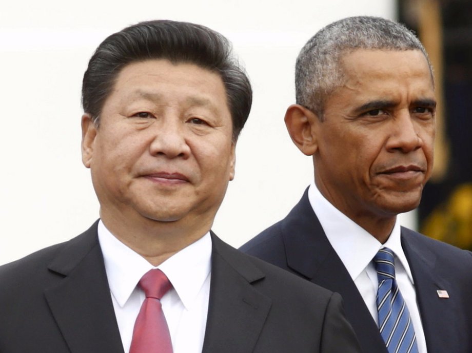 President Barack Obama stands with Chinese President Xi Jinping.