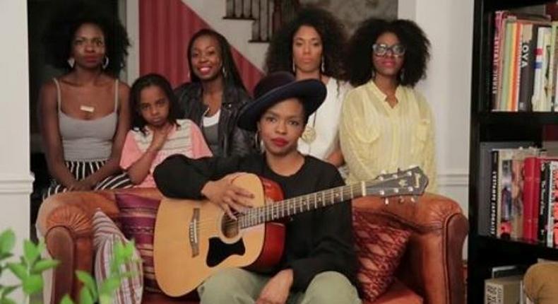 Lauryn Hill and some members of her band singing her hit song, That Thing