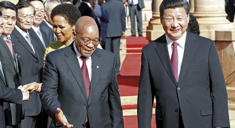 Chinese President Xi Jinping walks with South African President Jacob Zuma upon his arrival at the Union Buildings in Pretoria , December 2, 2015. REUTERS/Sydney Seshibedi