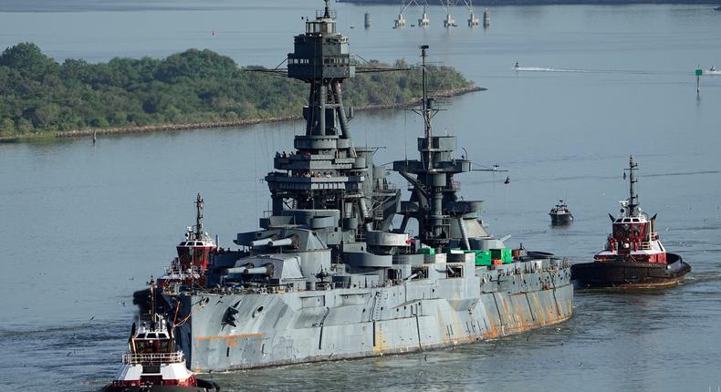 The USS Texas is towed down the Houston Ship Channel, Wednesday, Aug. 31, 2022, in Baytown, Texas. The vessel, which was commissioned in 1914 and served in both World War I and World War II, is being towed to a dry dock in Galveston where it will undergo an extensive $35 million repair.