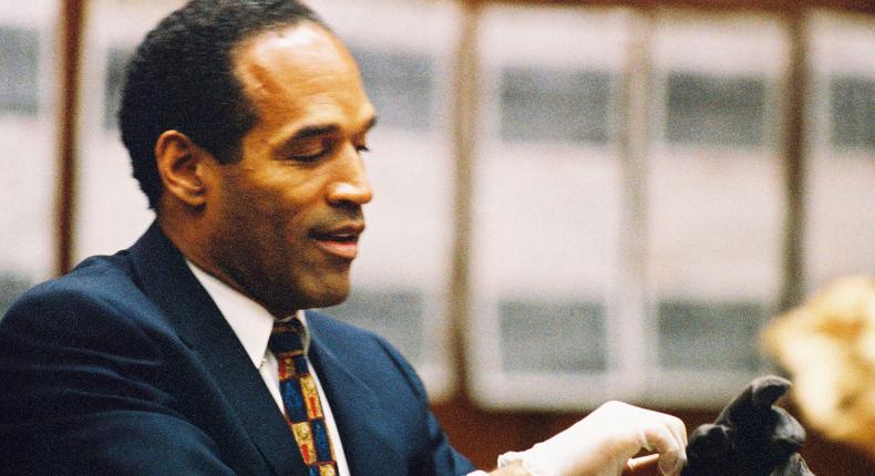 O.J. Simpson tries on a leather glove allegedly used in the murders.Lee Celano/WireImage/Getty Images