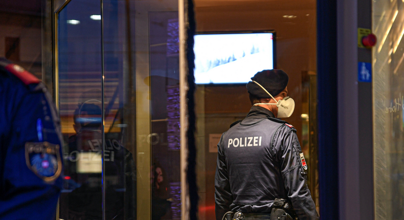 Policeman with respirator mask in Grand Hotel Europa in Austria