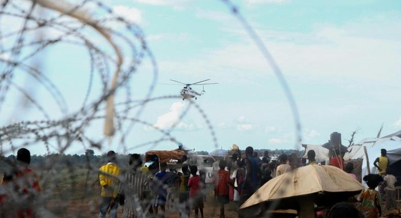 A UN helicopter flies over the newly formed camp for internally displaced people, in Kaga Bandoro, on October 18, 2016